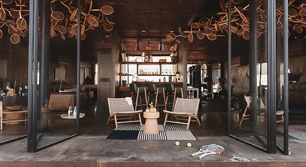 Inside the Athletic Lounge, under its tennis racquet chandeliers
