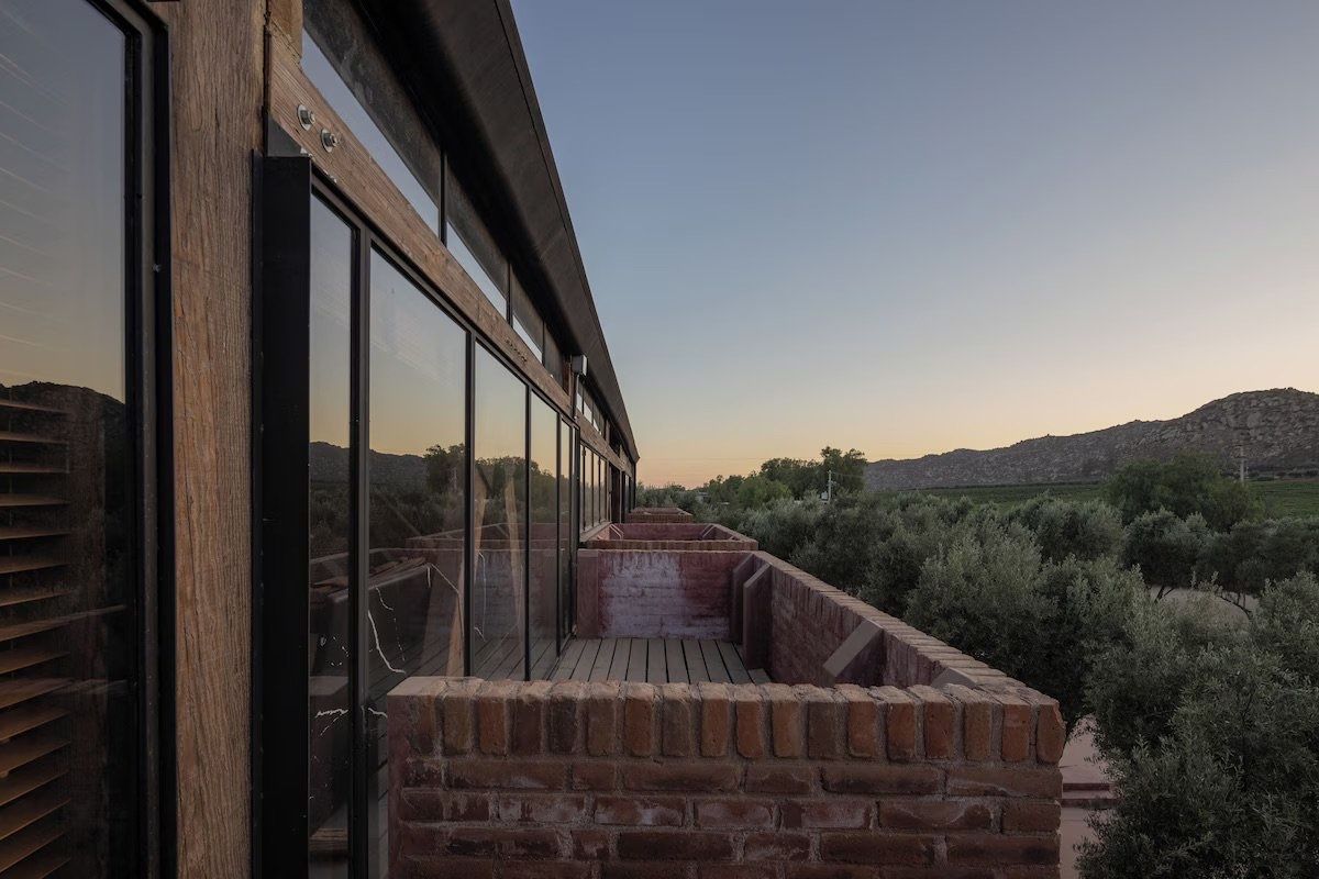 A balcony at Ático at sunset, looking over the hills